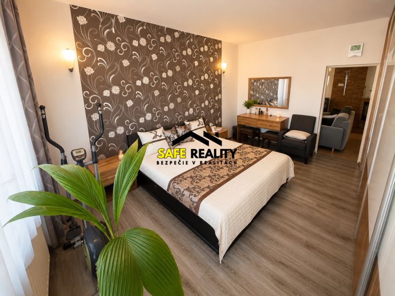 Elegant bedroom with dark wallpaper and wood-decor flooring in a family house.