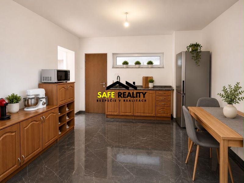 A kitchen in a family house with a wooden decor floor and stainless steel appliance.