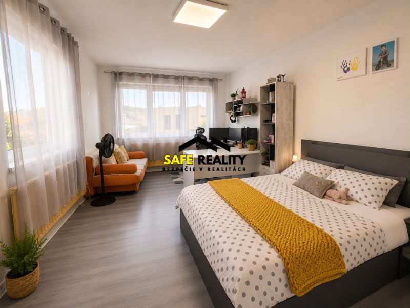 Bright bedroom in a family house with wood-patterned flooring and decorative elements.