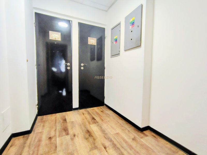 Black doors, white walls, wooden decor flooring in dining areas.