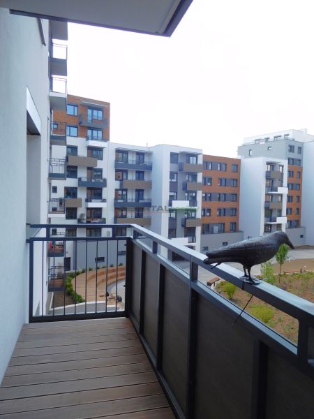 A balcony of a residential complex on Blumental Street in Bratislava with a garden view.