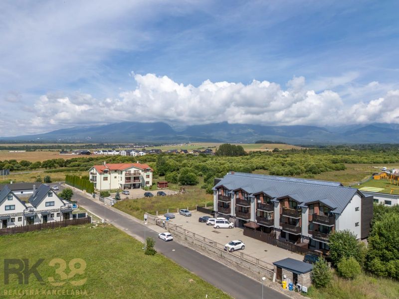 View of Futbalová Street in Veľká Lomnica, surrounded by nature and rural landscape.
