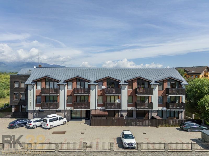 An apartment building on Futbalová Street in Veľká Lomnica surrounded by nature and mountains.