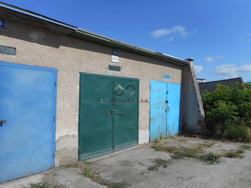 Garages on Ľudovíta Stárka Street in Trenčín, with blue and green doors.