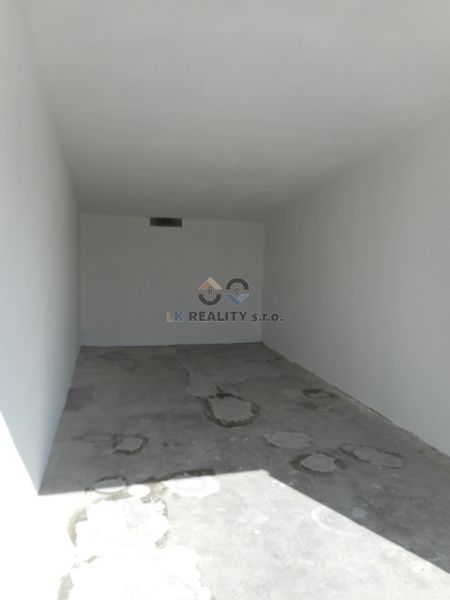 An empty concrete garage on Ľudovíta Stárka Street in Trenčín.