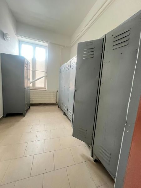 Interior of a production area with lockers and a window.