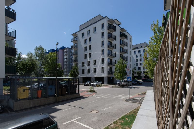Apartment building on Agátová Street in Bratislava - Dúbravka with a parking zone and greenery.