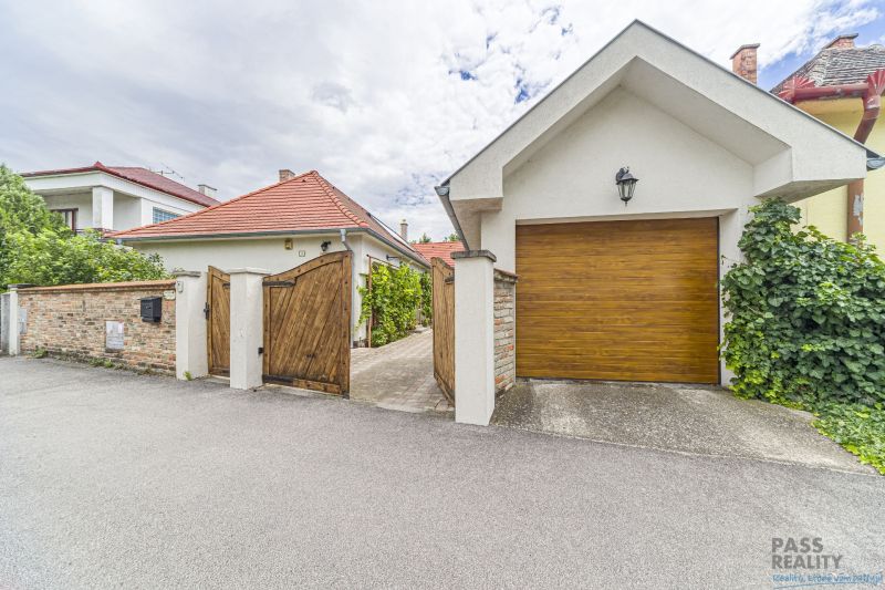 A family house on Čigérska Street in Dunajská Streda with a wooden gate.