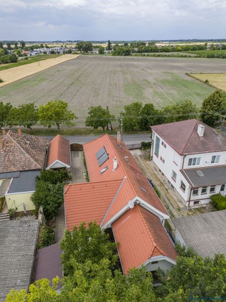 A family house on Čigérska Street in Dunajská Streda next to a vast field.
