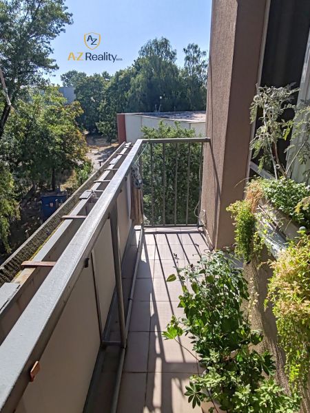 A balcony with a view of greenery and buildings, 4-room apartment, Hradná, Komárno.