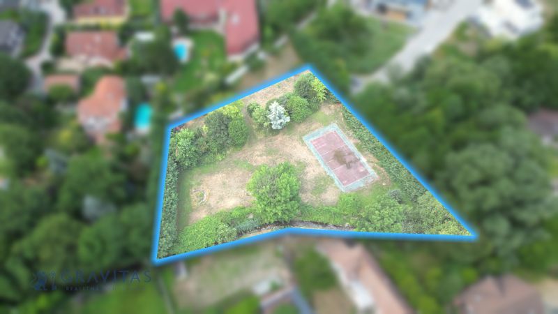 Aerial footage shows a plot of land on Krátka Street in Limbach, suitable for living.