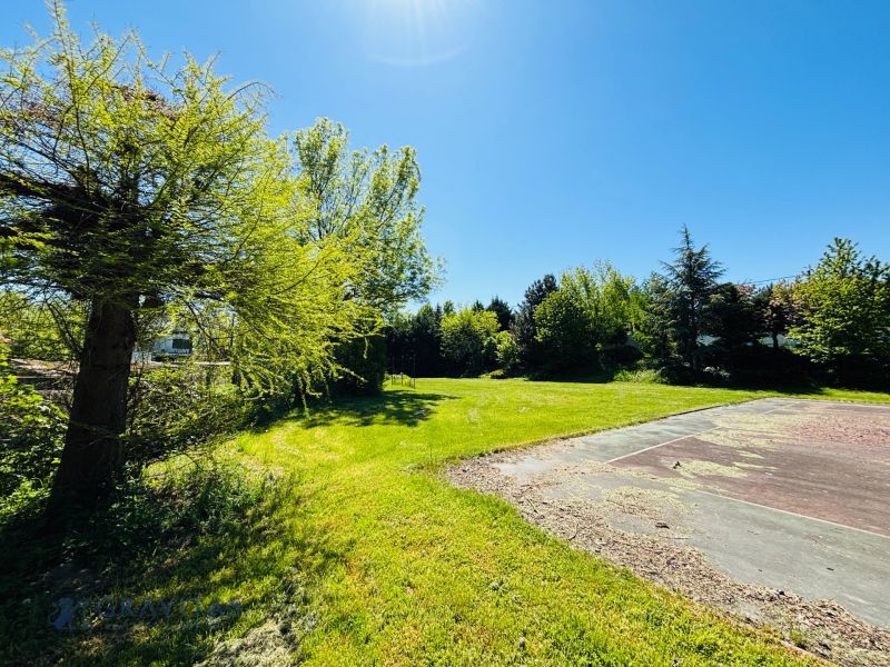 Sunny plot on Krátka Street in Limbach. Residential land surrounded by greenery.