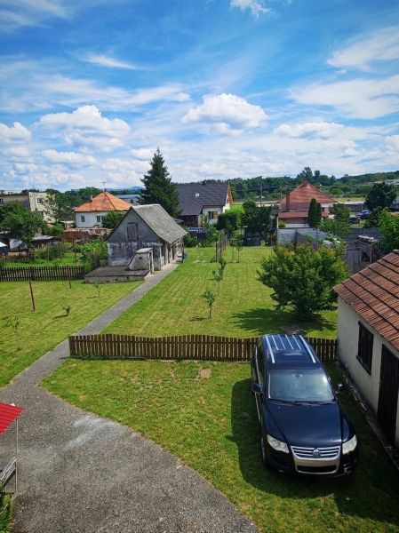 A family house in Lakšárska Nová Ves with a spacious garden and parking space.
