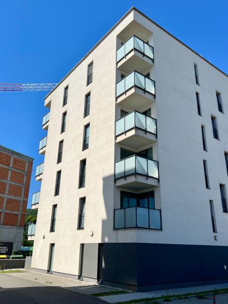 Apartment building in Prešov with balconies suitable for 2-room apartments, exterior view.