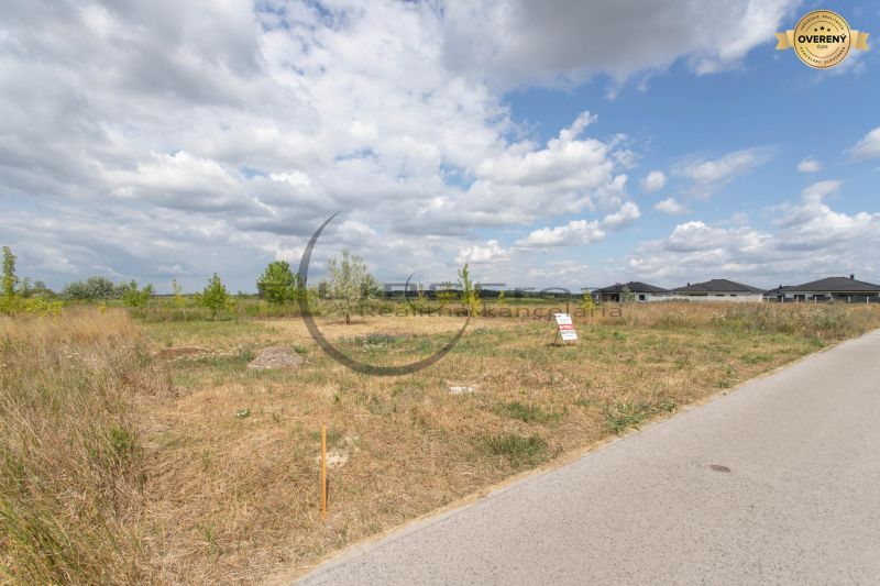 A residential plot on Brezová Street in Zohor, with a view of the surrounding houses.