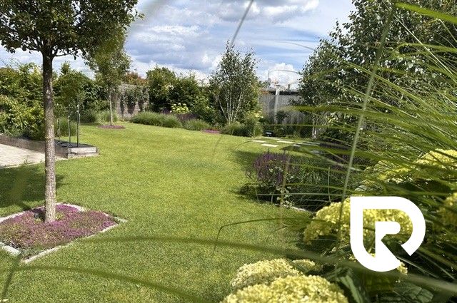 The garden of a family house on Rizlingova Street in Trenčín with a well-maintained lawn and plantings.