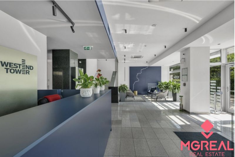 Reception with vases of green plants in the offices at the Westend Tower building.