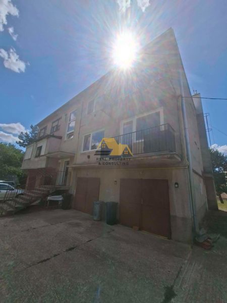 A family house with a garage on a sunny day.