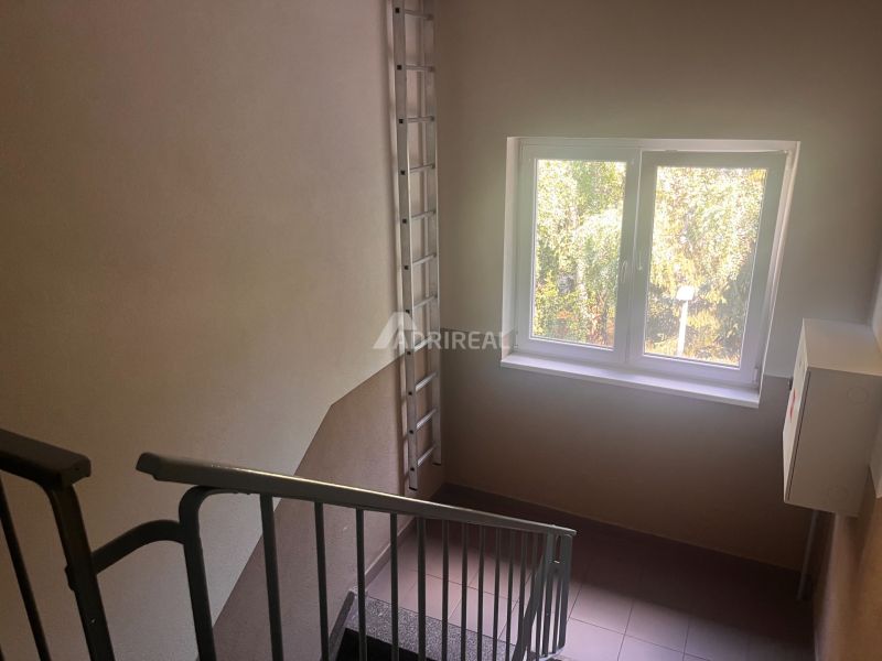 Staircase with metal railing and a window with a view, Kežmarok, Gen. Štefánika.
