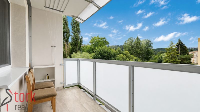 A balcony with a view of greenery in a 1-room apartment, Považská Bystrica, SNP street.