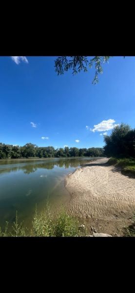 River and sandy beach in Neded, suitable for residential land.