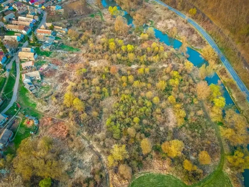 Aerial view of properties - housing surrounded by greenery and water bodies in Muli.