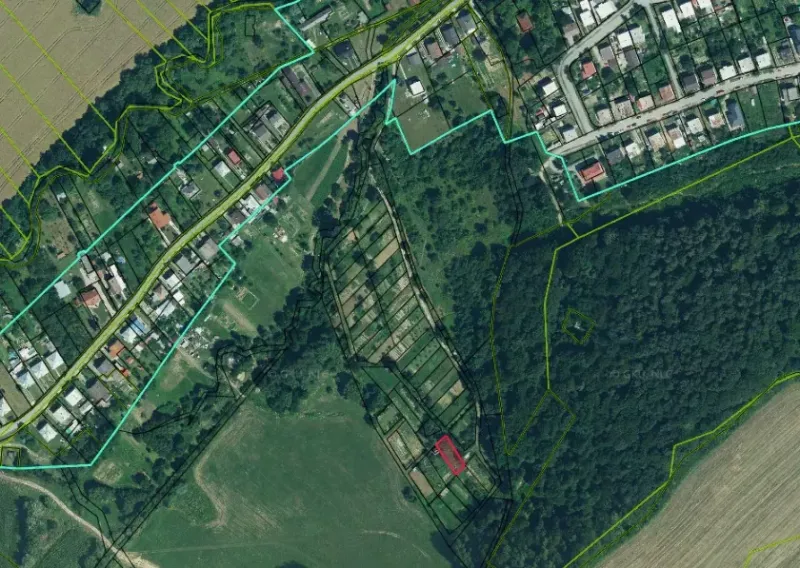 Aerial view of gardens in Bystré with forest and agricultural areas.