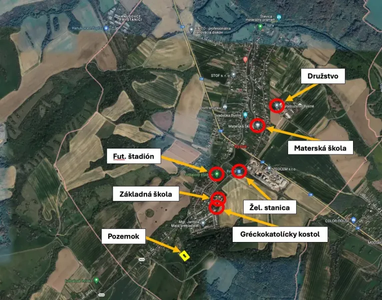 Aerial view of Bystré with highlighted schools, station, and sports facilities.