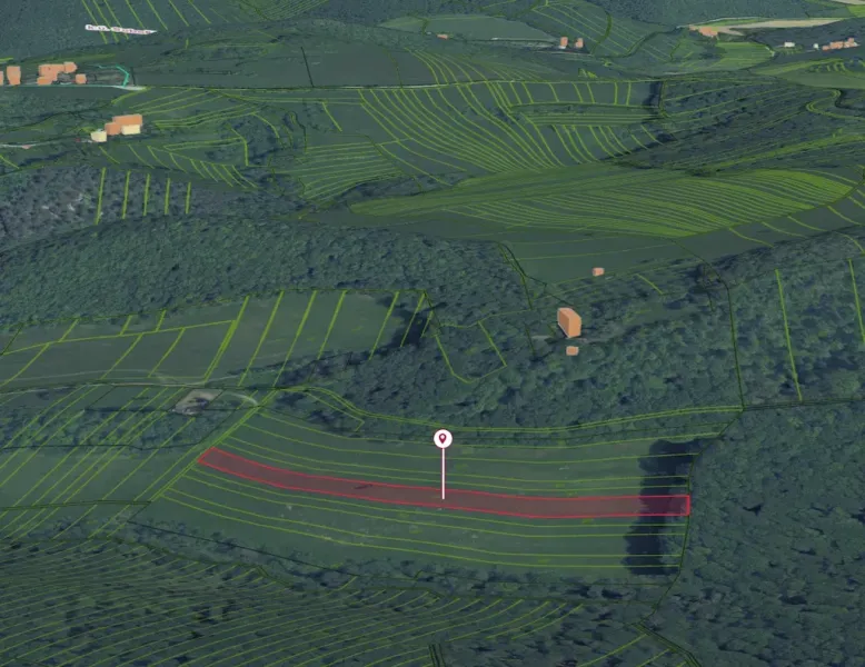 Aerial view of extensive fields around Podbranč, the gardens are divided by lines.