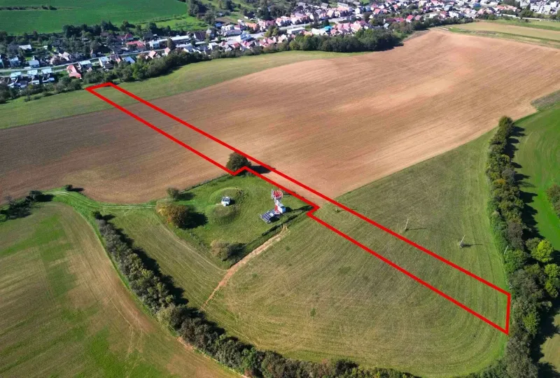 Aerial view of agricultural and forest land near Trenčianske Stankovce, bordered by a red line.