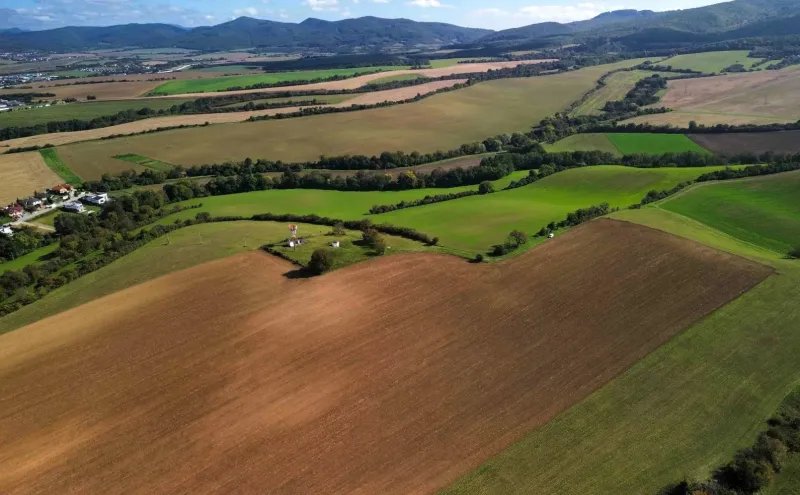 Meadows and fields on agricultural and forest lands in Trenčianske Stankovce under the mountains.