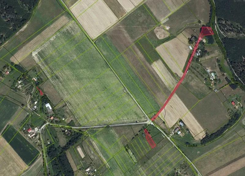 Aerial view of agricultural and forest land around the village of Muľa.