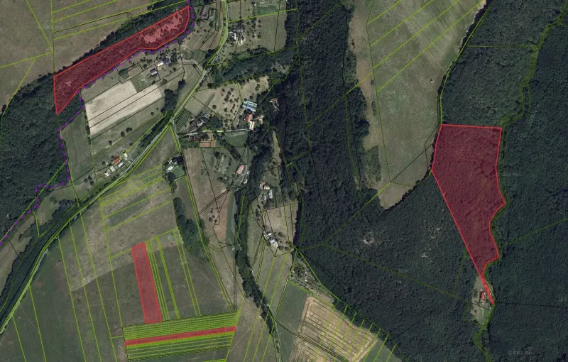 Aerial view of agricultural and forest lands around the village of Muľa.