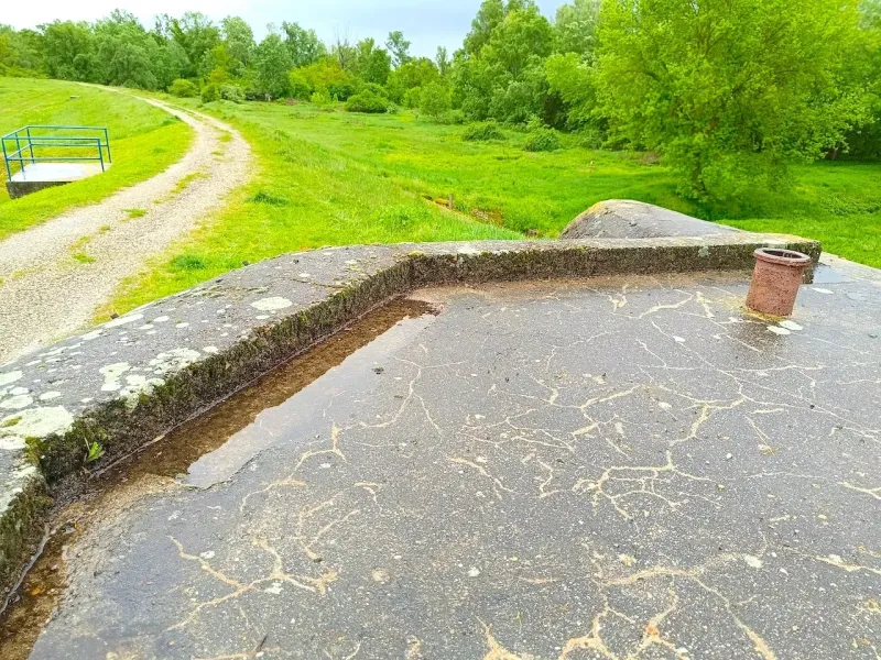 Unusual properties in Malacky, detail of a concrete area with a view of the green terrain.