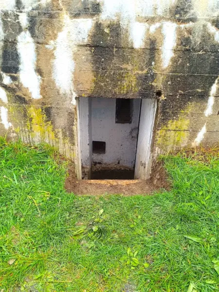 Unusual properties in Malacky with grassy vegetation and a small entrance in the wall.
