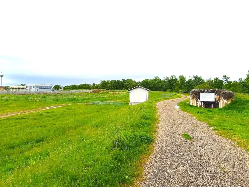 Unique properties in the town of Malacky, including a bunker and a building in a green environment.