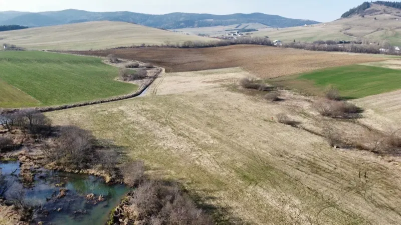 Agricultural and forest lands in Podhorany, with beautiful hilly landscapes and pastures.
