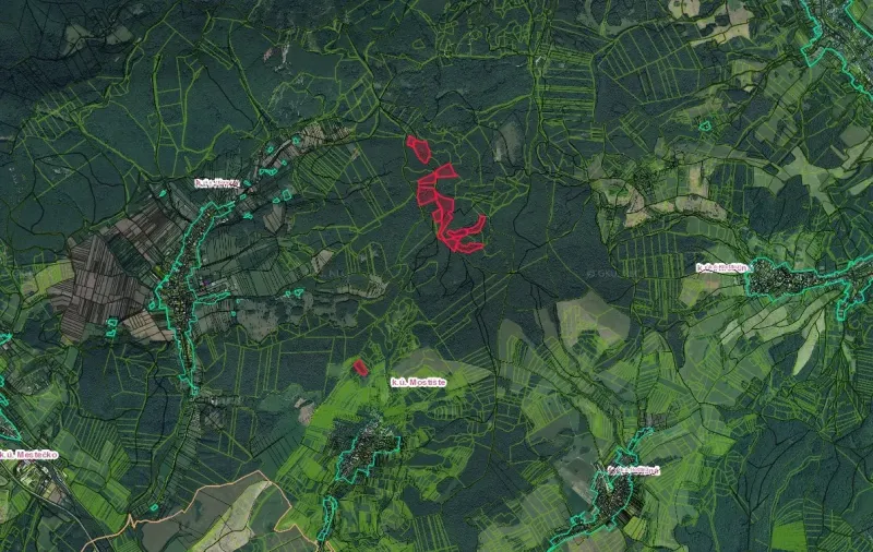 An aerial view of agricultural and forest lands around Dohňany.