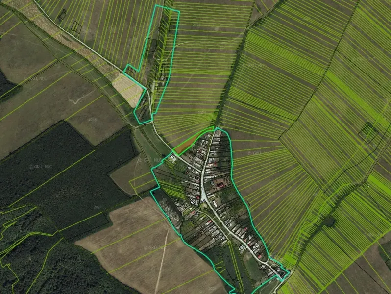 Aerial view of Barca with peculiar properties and surrounding fields.