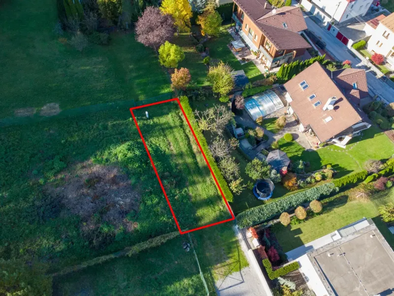 Aerial view of green gardens in Banská Bystrica with a highlighted plot.