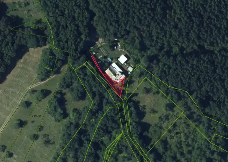 Aerial view of unusual properties in Krupina, surrounded by forests and plots.