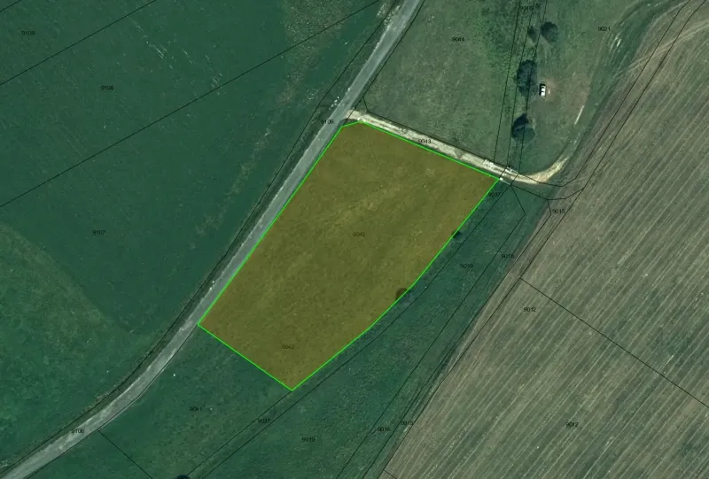 Aerial view of agricultural and forest land in the village of Podhorany.