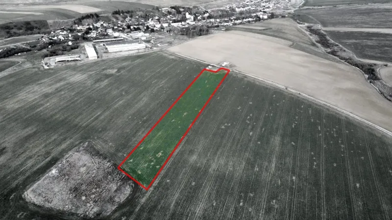 Aerial view of agricultural and forest land in Podhorany, highlighted plot.
