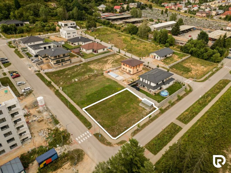 Aerial view of properties - housing in Brezno, Štvrť kasárne, surrounded by development and nature.