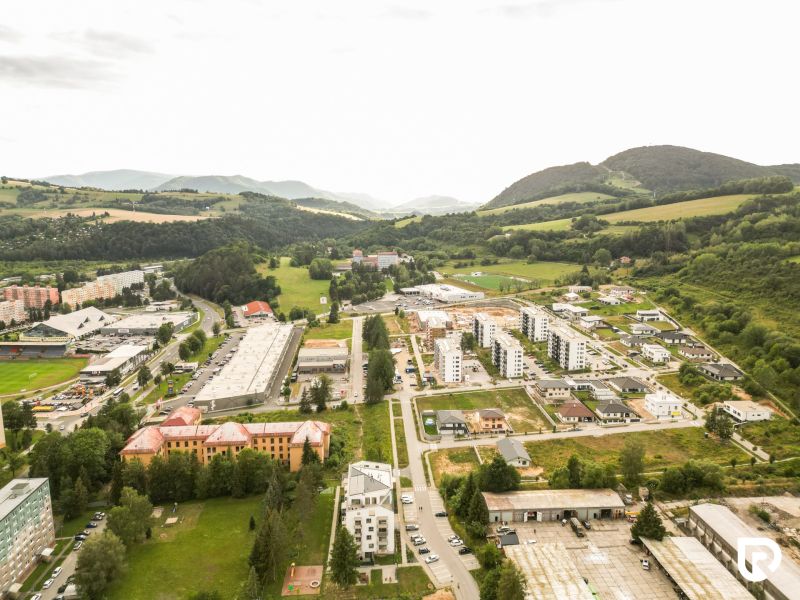 Aerial view of Brezno, Barracks Quarter, surrounded by greenery and residential buildings, suitable for Plots - housing.