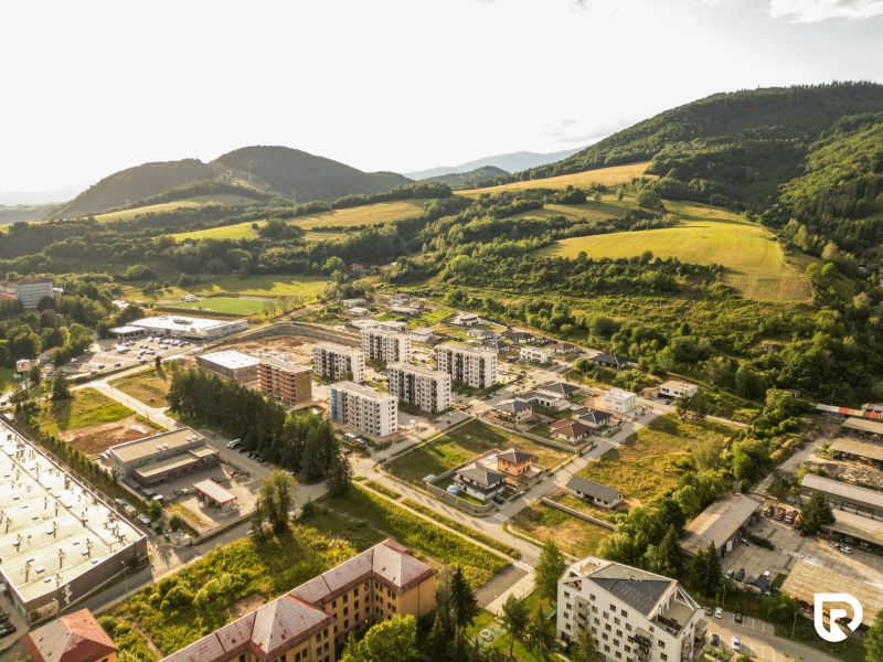 A view of the Barracks District in Brezno - Residential plots in a mountainous environment.