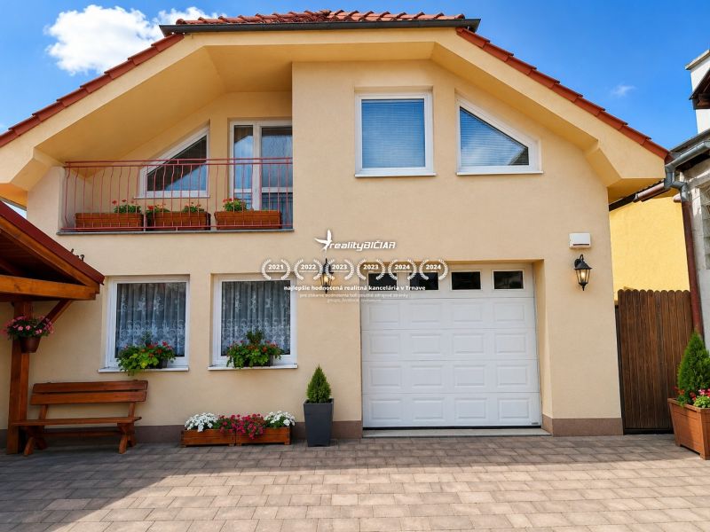 A family house on Hrnčiarska Street in Sereď with a balcony and floral decorations.