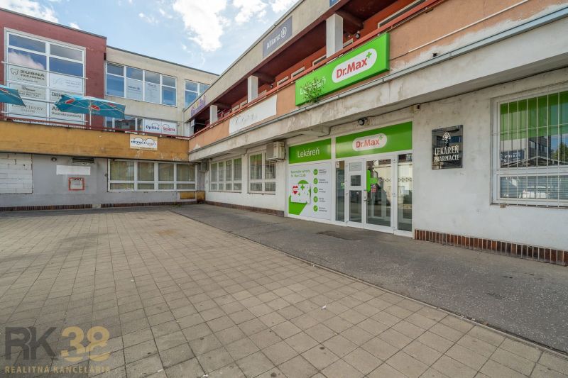 Building in Banská Bystrica with Dr.Max pharmacy and surrounding establishments.
