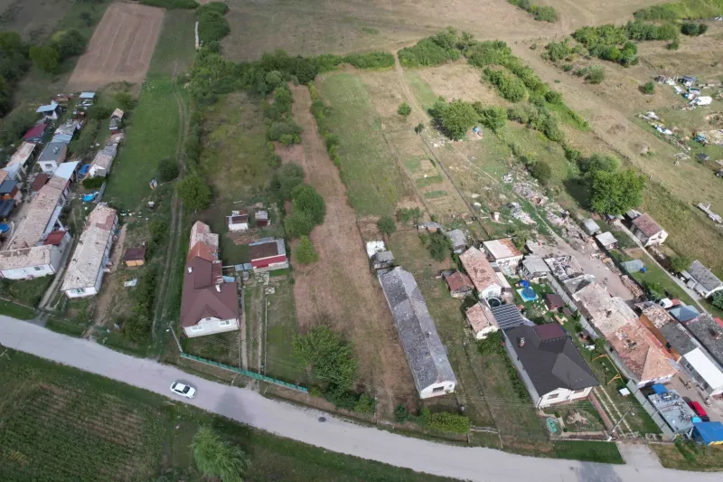 Aerial view of plots - housing in the town of Rakytník surrounded by houses and nature.