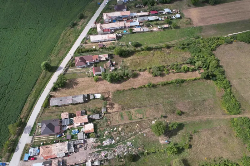Aerial view of residential plots in Rakytník surrounded by nature and roads.